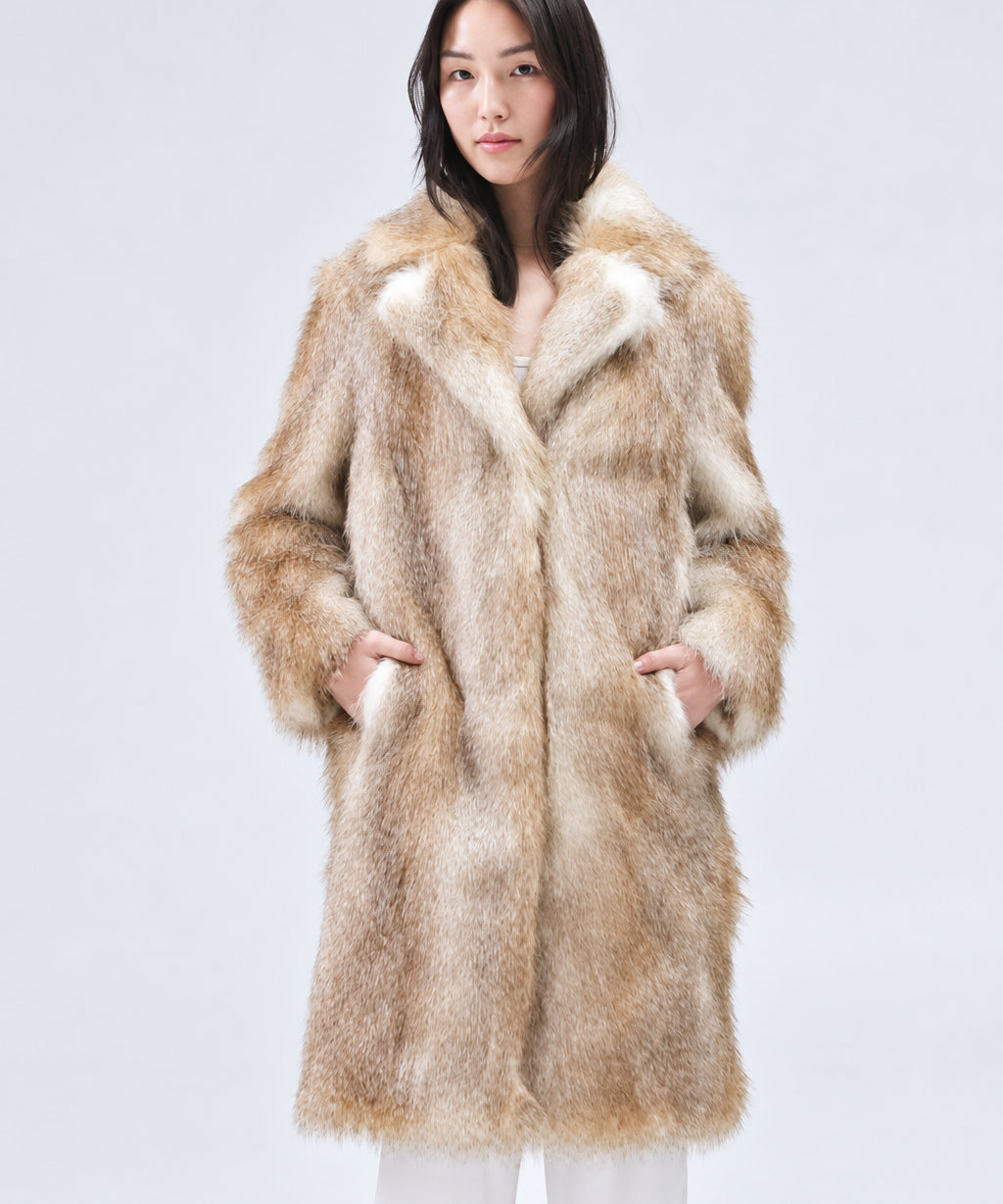 Person wearing a fur coat against a plain background