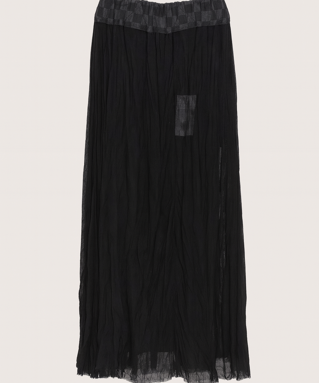 Black pleated skirt with lace waistband on a light gray background