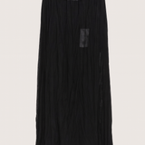 Black pleated skirt with lace waistband on a light gray background